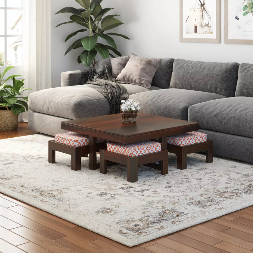 Khimsar square coffee table set in dark teak with pink patterned stool cushions