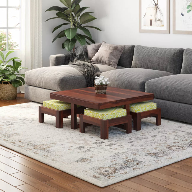 Khimsar square coffee table set with 4 cushioned stools in honey teak on a grey rug