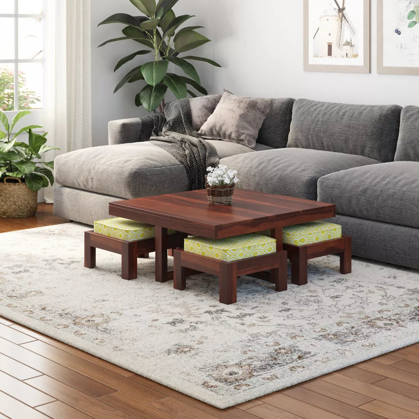 Khimsar square coffee table set with 4 cushioned stools in honey teak on a grey rug