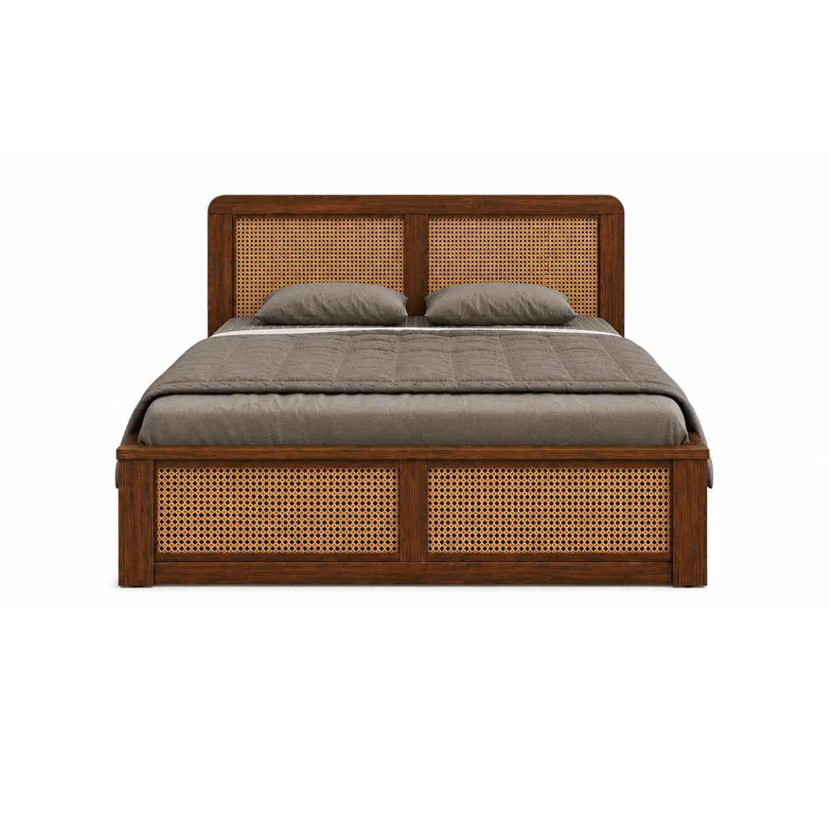 A wooden platform bed with a dark brown finish and woven cane panels on the headboard and footboard, dressed in a gray quilt and two gray pillows, shown against a plain white background.