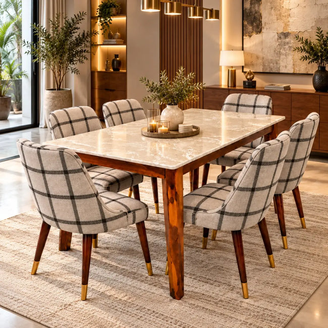 Marvaan marble top 6 seater dining table set with checkered upholstered chairs in a modern dining room