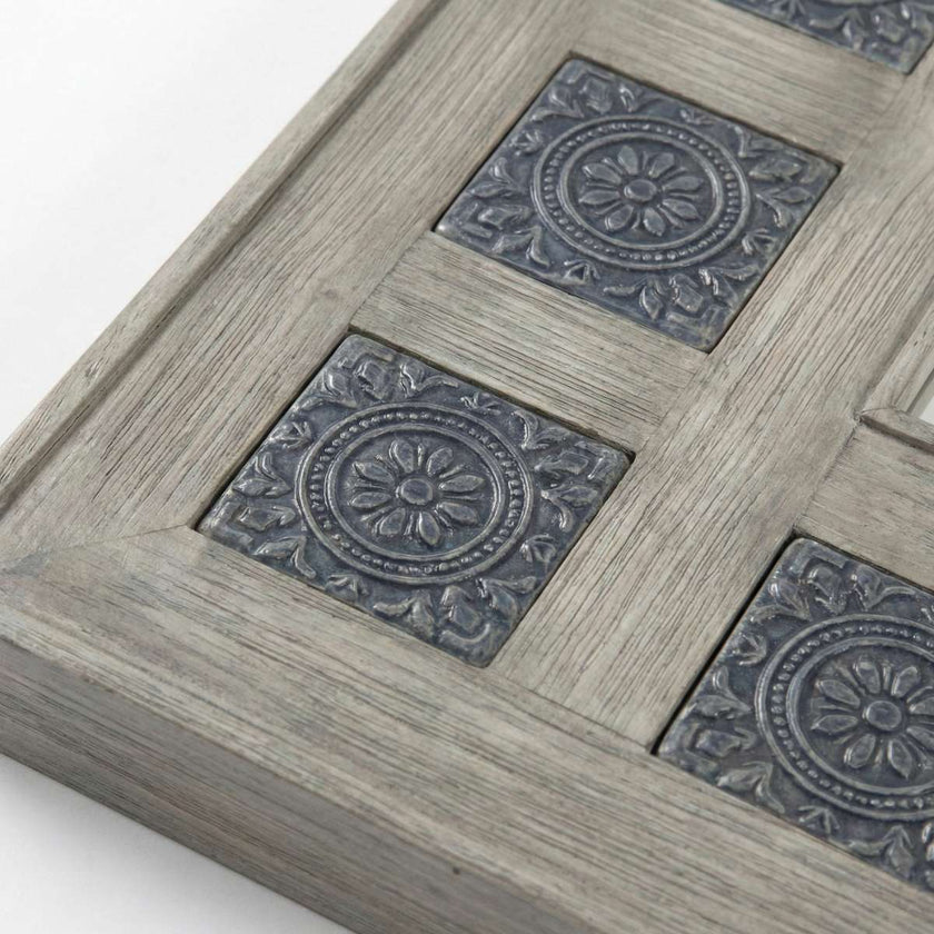 Angled view of Meher Heritage hand-carved teak wood full length floor mirror with patterned tile border