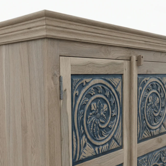 Close-up of blue hand-carved panel detailing on Meher rustic teak wood almirah cabinet