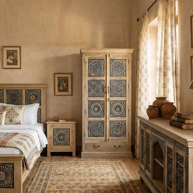 Meher rustic teak wood carved almirah cabinet with blue hand-carved panels in bedroom setting