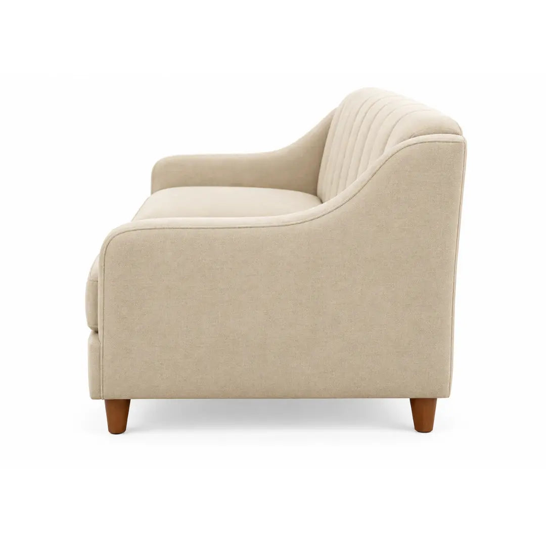 Side profile of the Noorvan 3 seater beige fabric sofa with sloped arm and wooden legs