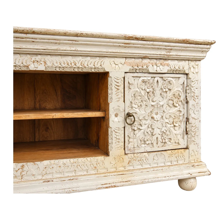 Close-up of Phoolvan TV unit floral carved door, ring pull and natural wood open shelf
