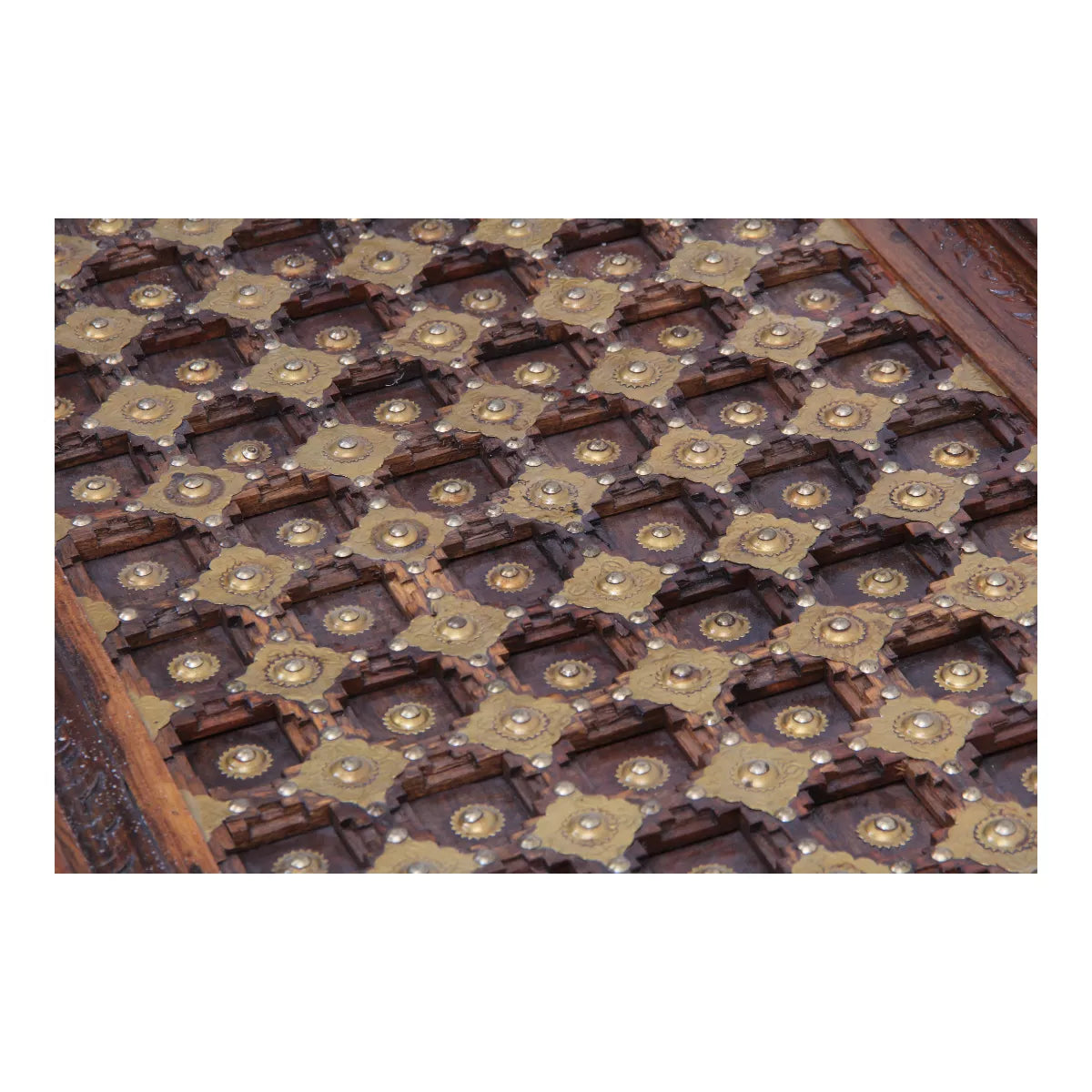 Close-up of hammered brass grid top on Rajasthani vintage center table