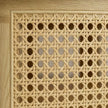 Close-up of handwoven rattan cane on round coffee table