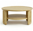 Round cane coffee table side view showing open storage shelf