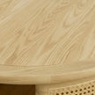 Close-up of round solid wood coffee table top in natural finish