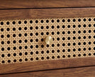 Rattan cane drawer front with brass knob on solid wood coffee table