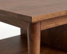 Tabletop corner and leg detail of solid wood coffee table