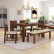 A solid wood dining set with a rectangular table and matching chairs, placed in a room with a light color scheme and modern decor.