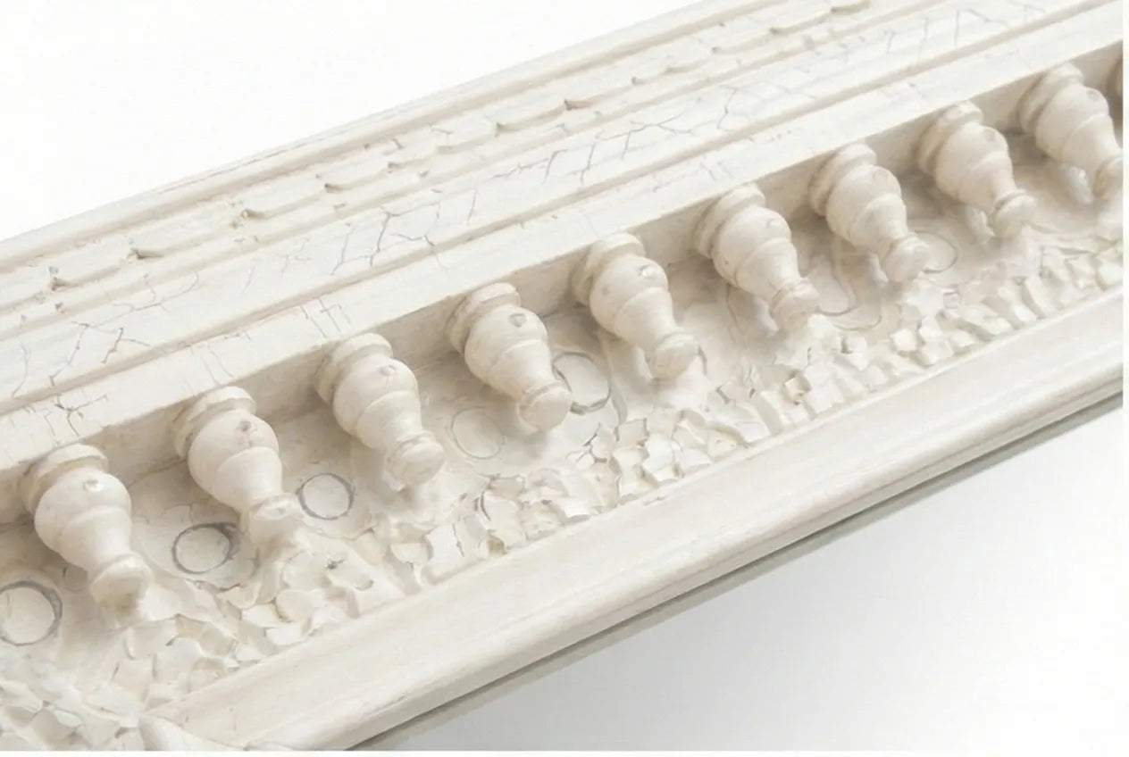 Close-up of the sculpted spindle-style accents on the Vintage White Wooden Wall Mirror