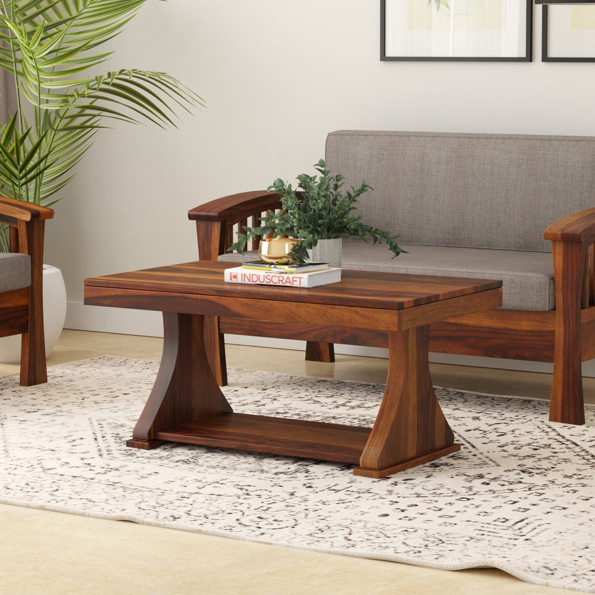 Yeshua rectangular sheesham wood coffee table with pedestal base in a living room